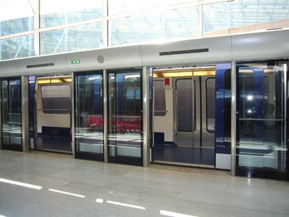 Showing CDGVAL shuttle train open doors on arrival at terminal 1 at CDG airport