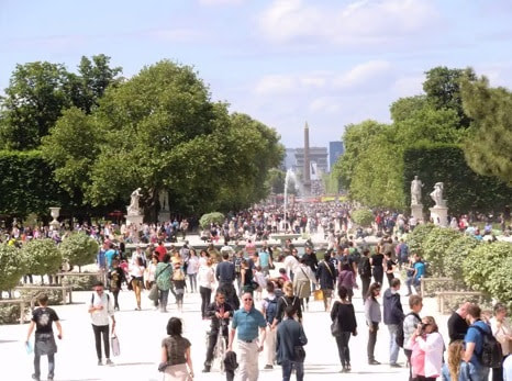 people walking through the Tuileries Gardens in the first arrondissement of Paris